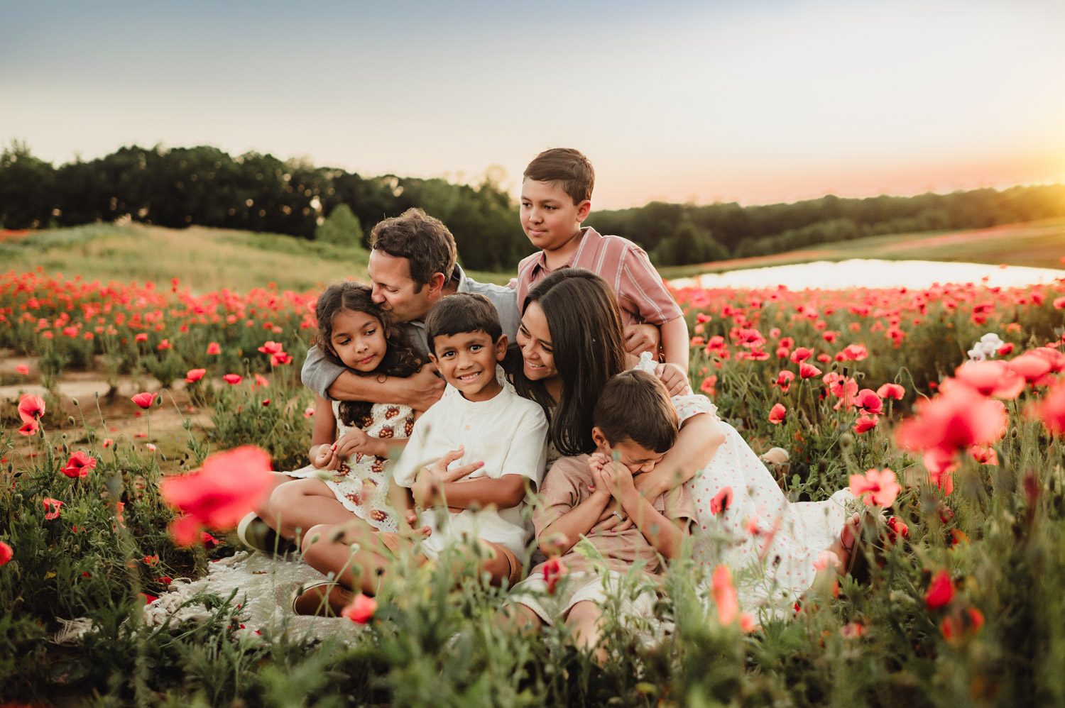 Family photography session in a field of poppies at Dogwood Farms, Belews Creek, NC